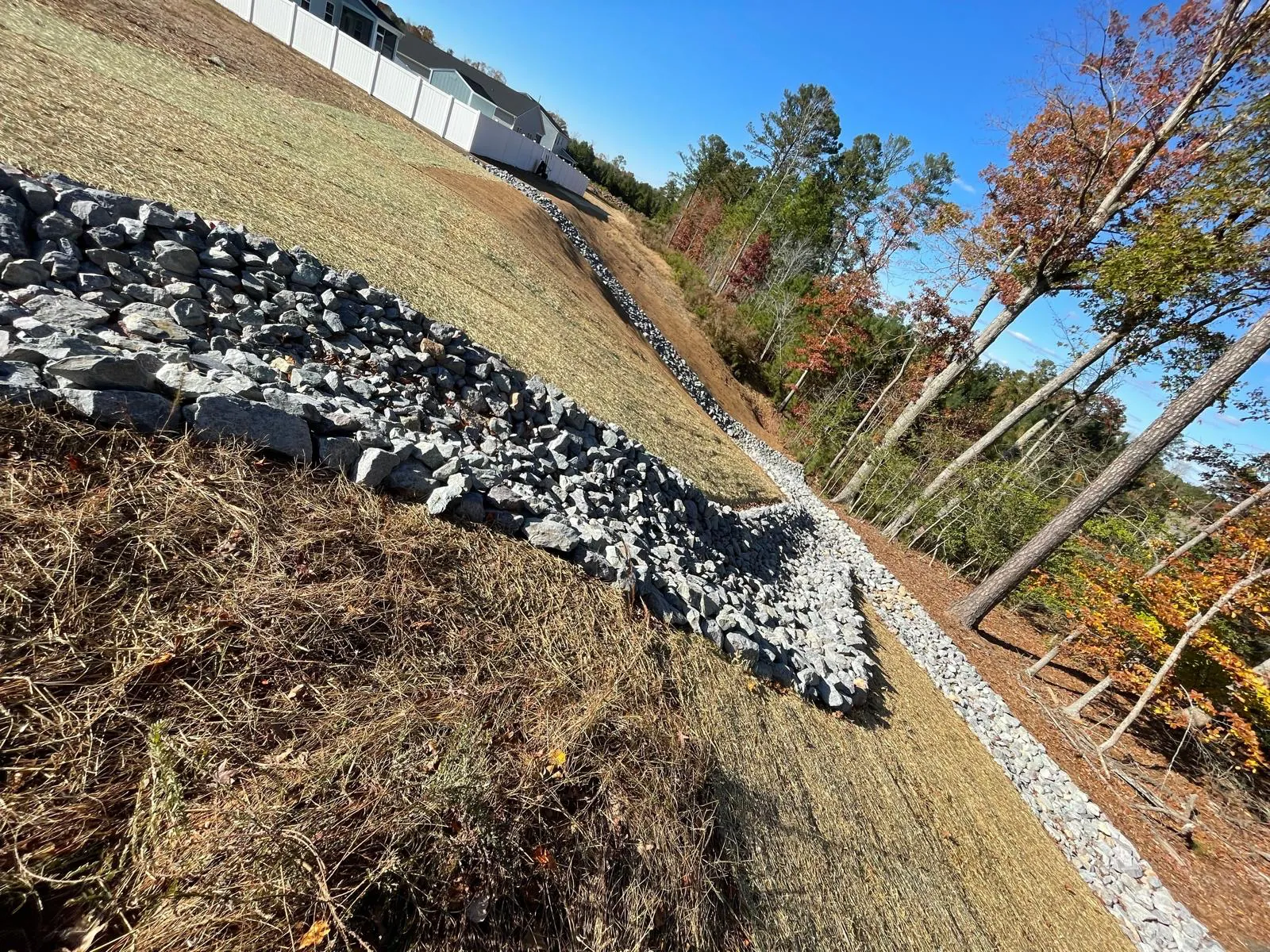 Finished rip-rap channel along a hydroseeded slope at Autumnwood