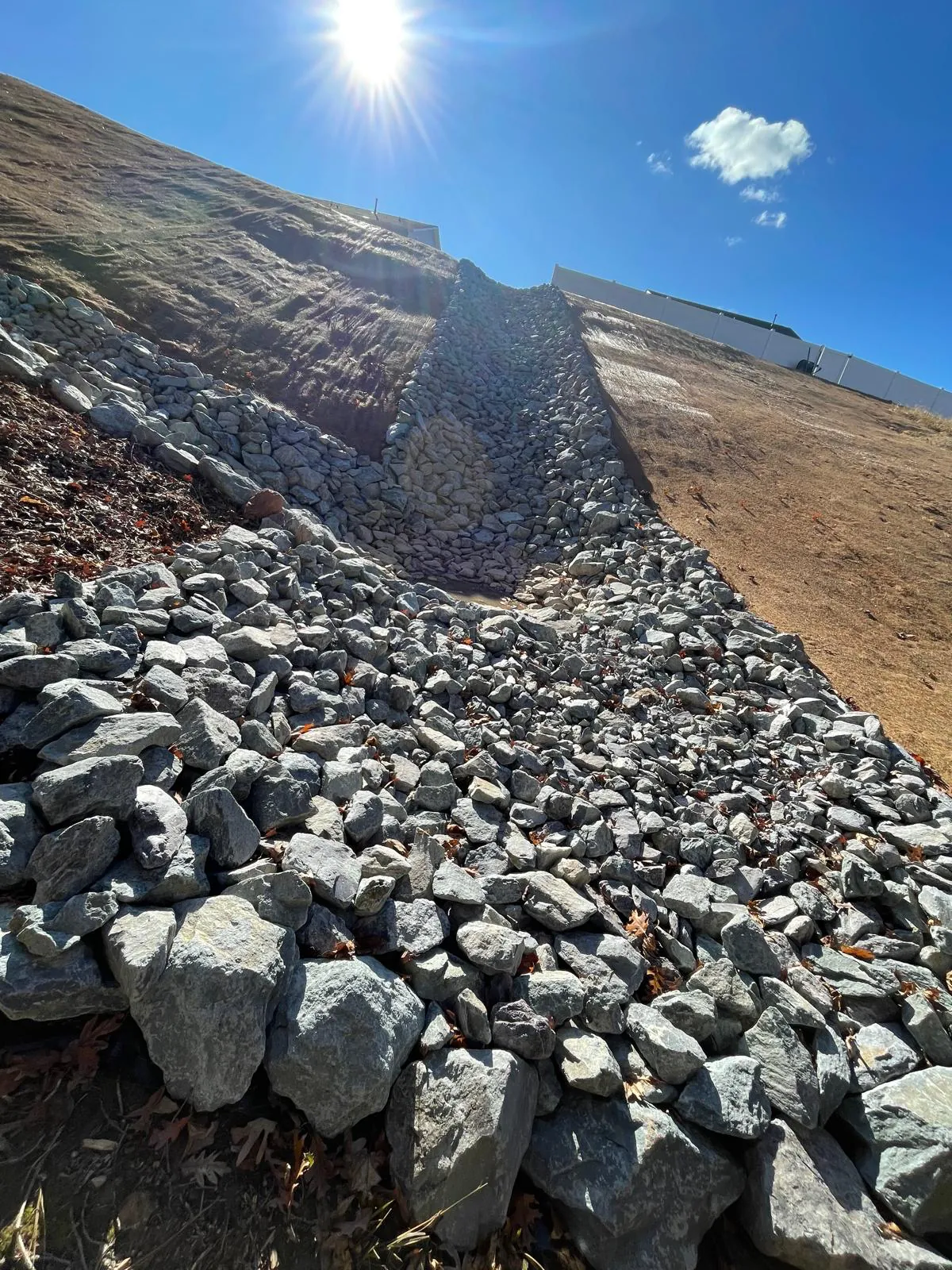 Detail of a rip-rap lined drainage channel at Autumnwood