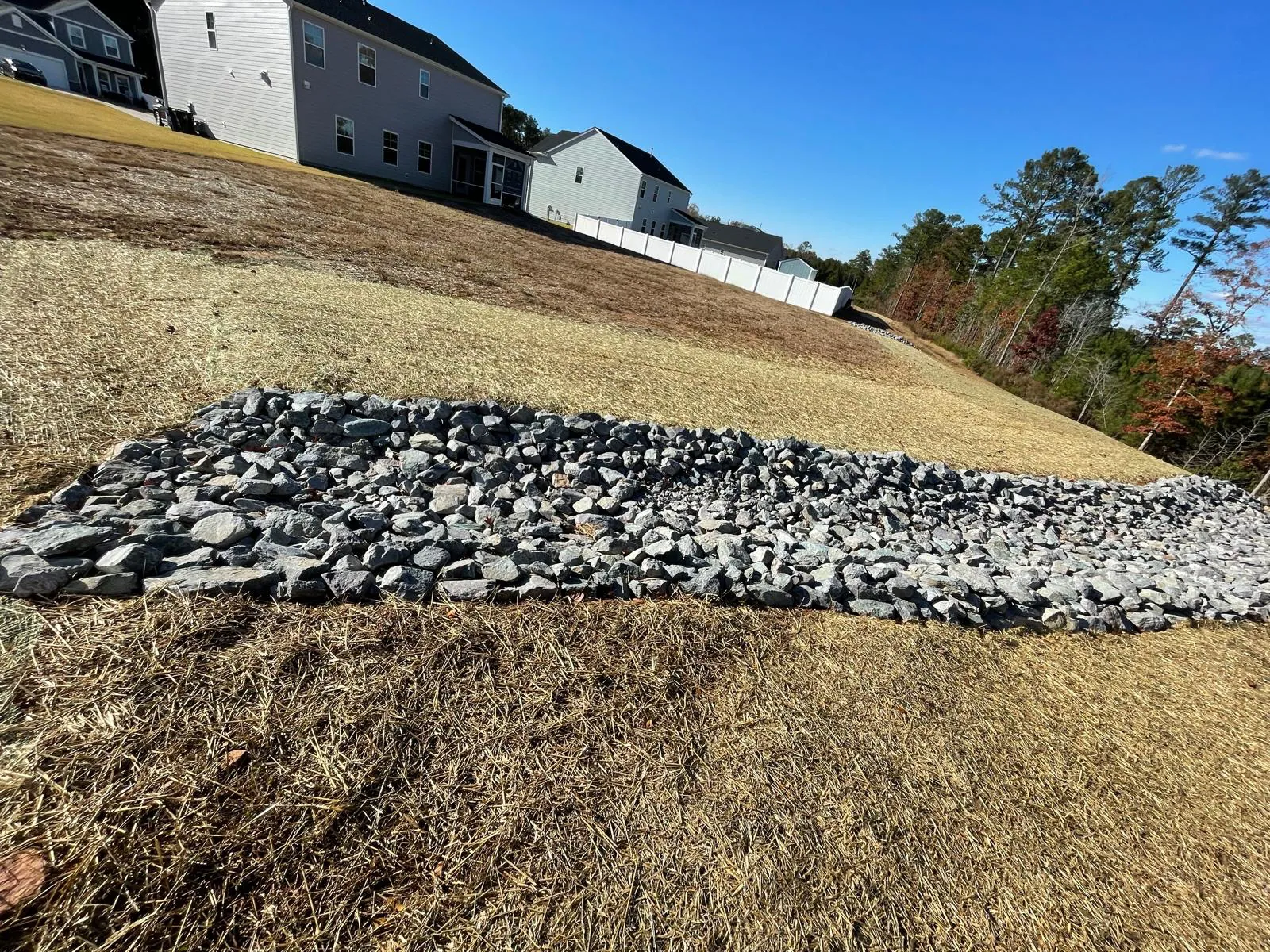Finished rip-rap channel on a stabilized slope near homes at Autumnwood