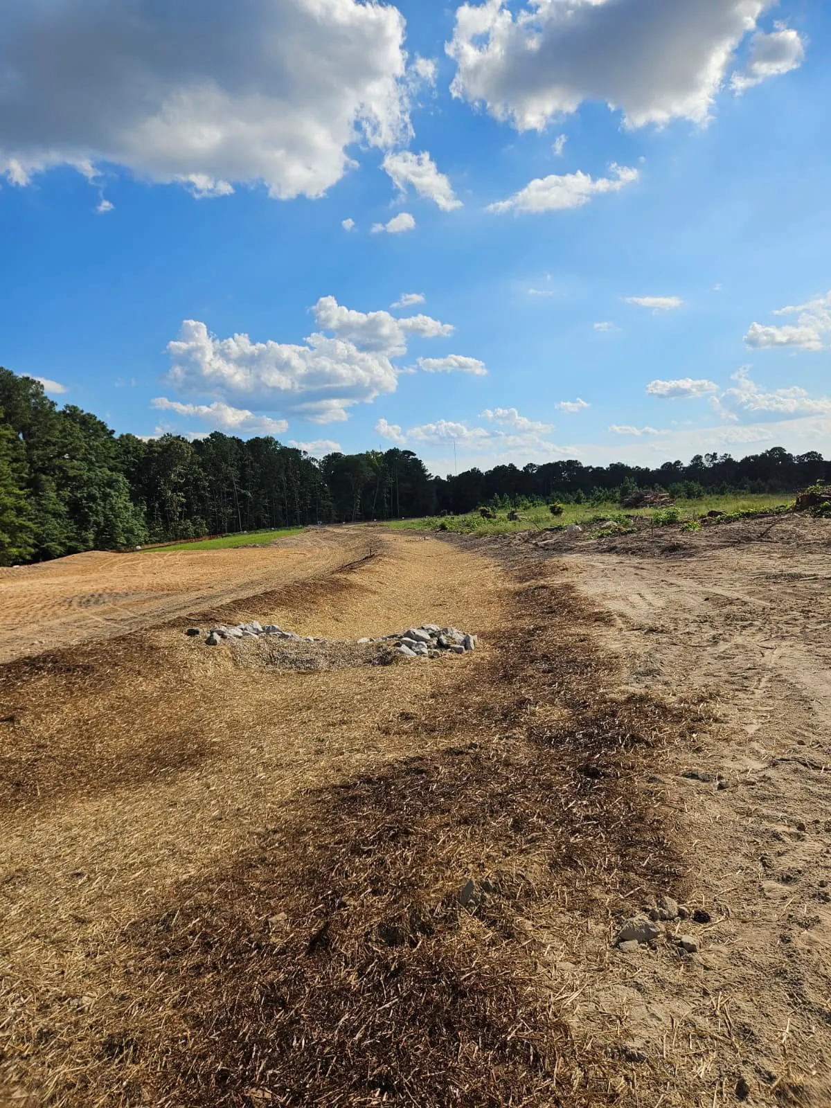 Long stormwater channel with rip-rap at Banks Twenty