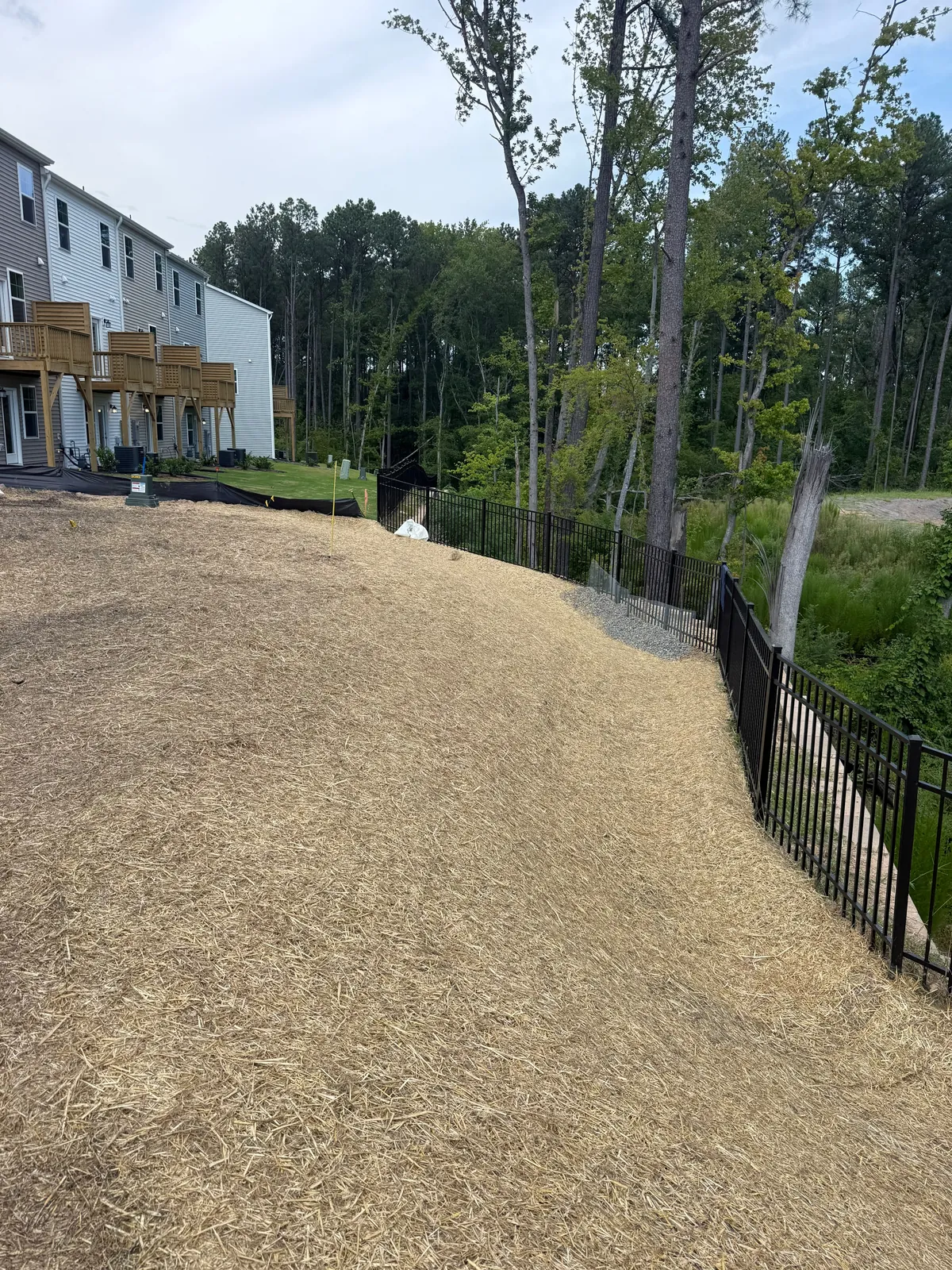 Silt fence line along a graded slope at Mica Ridge