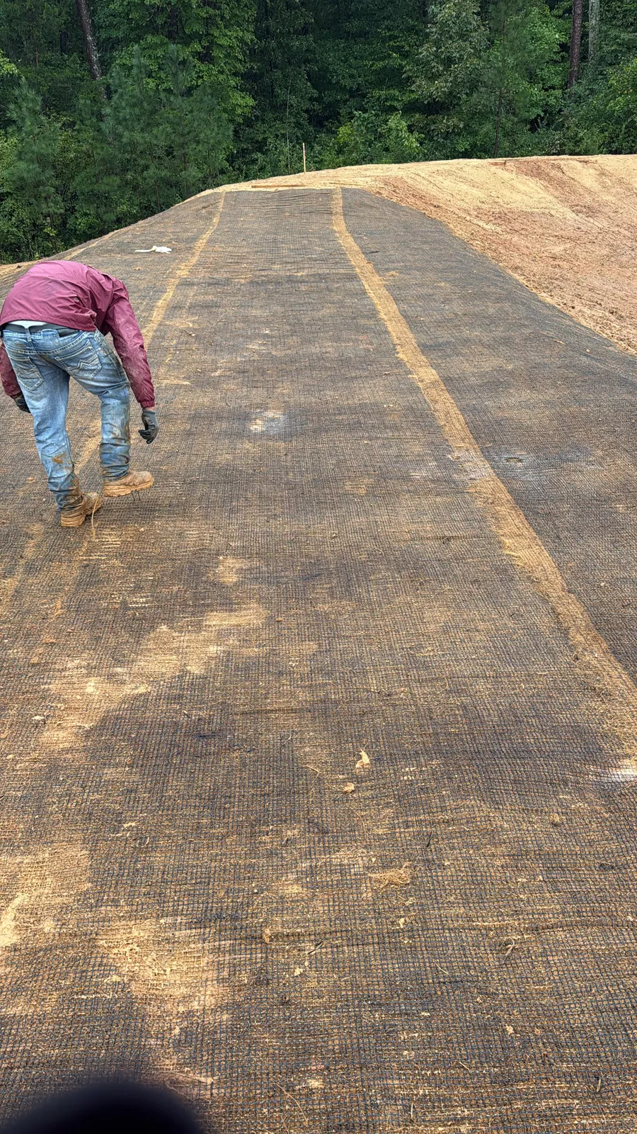 Crew installing erosion control matting at Sagecroft