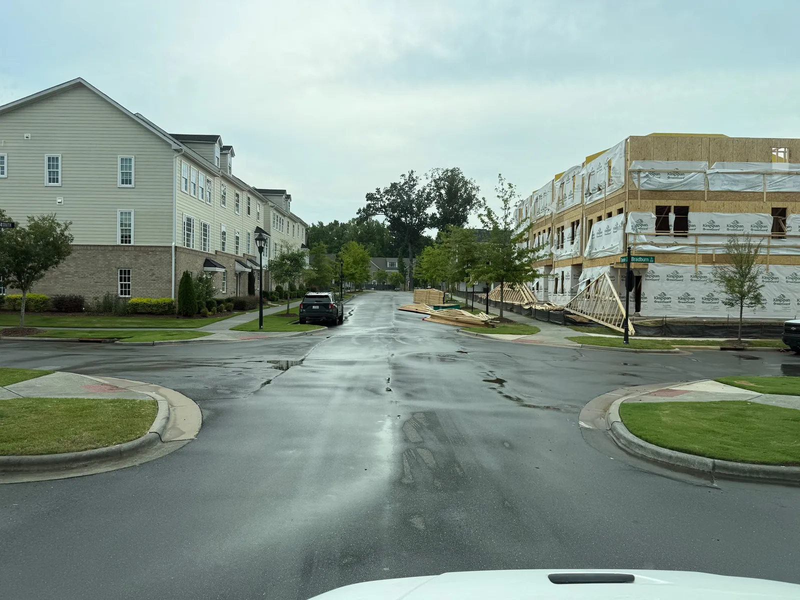 Washed street at a townhome community roundabout