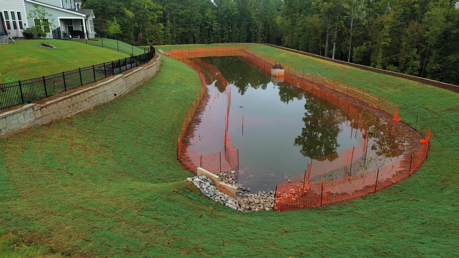 Aerial view of a finished pond conversion at Ovation at Sweetbrier