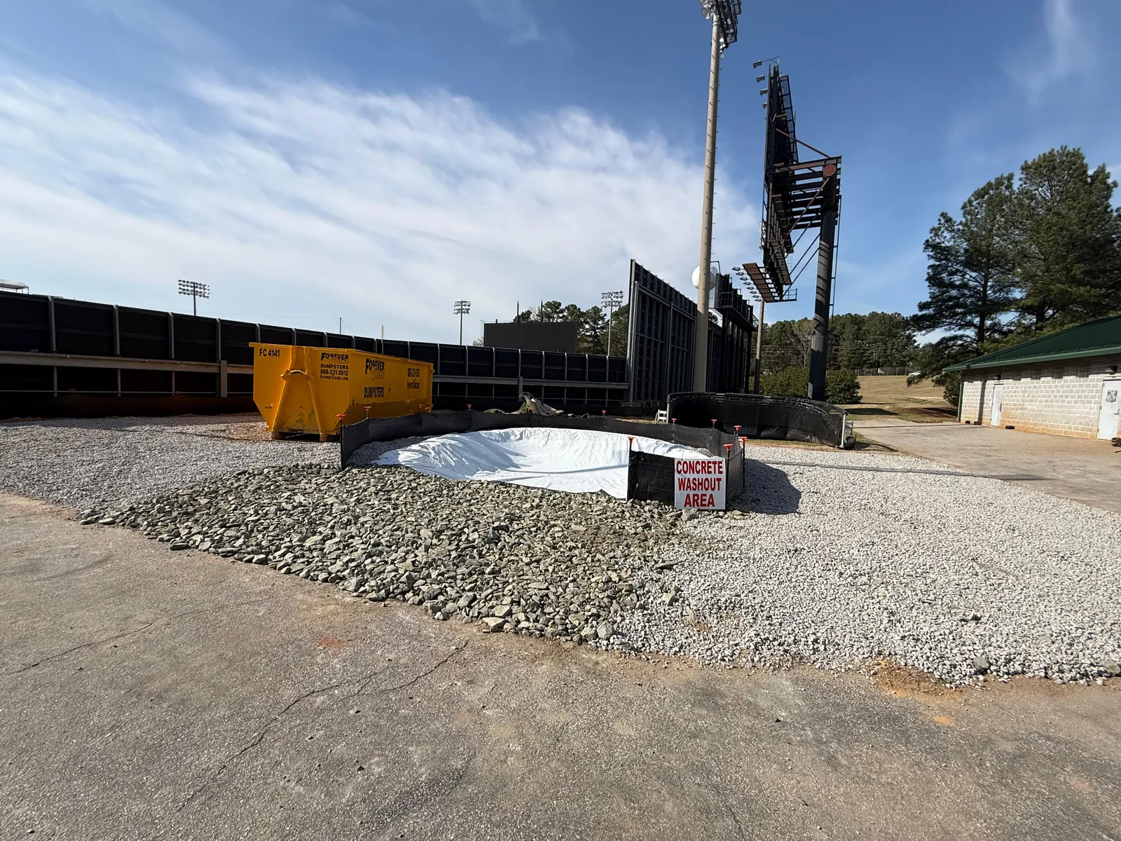 Completed lined concrete washout area with signage