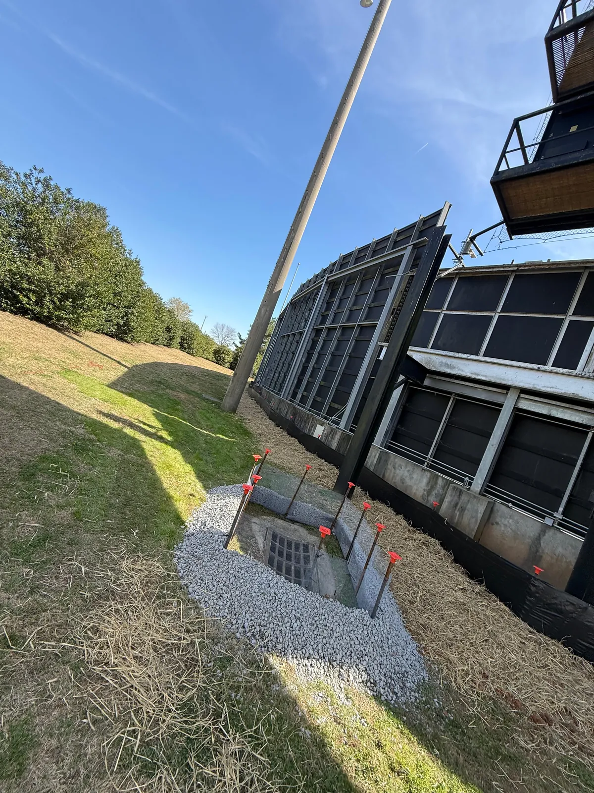 Grated drop inlet with rip-rap protection and silt fence markers