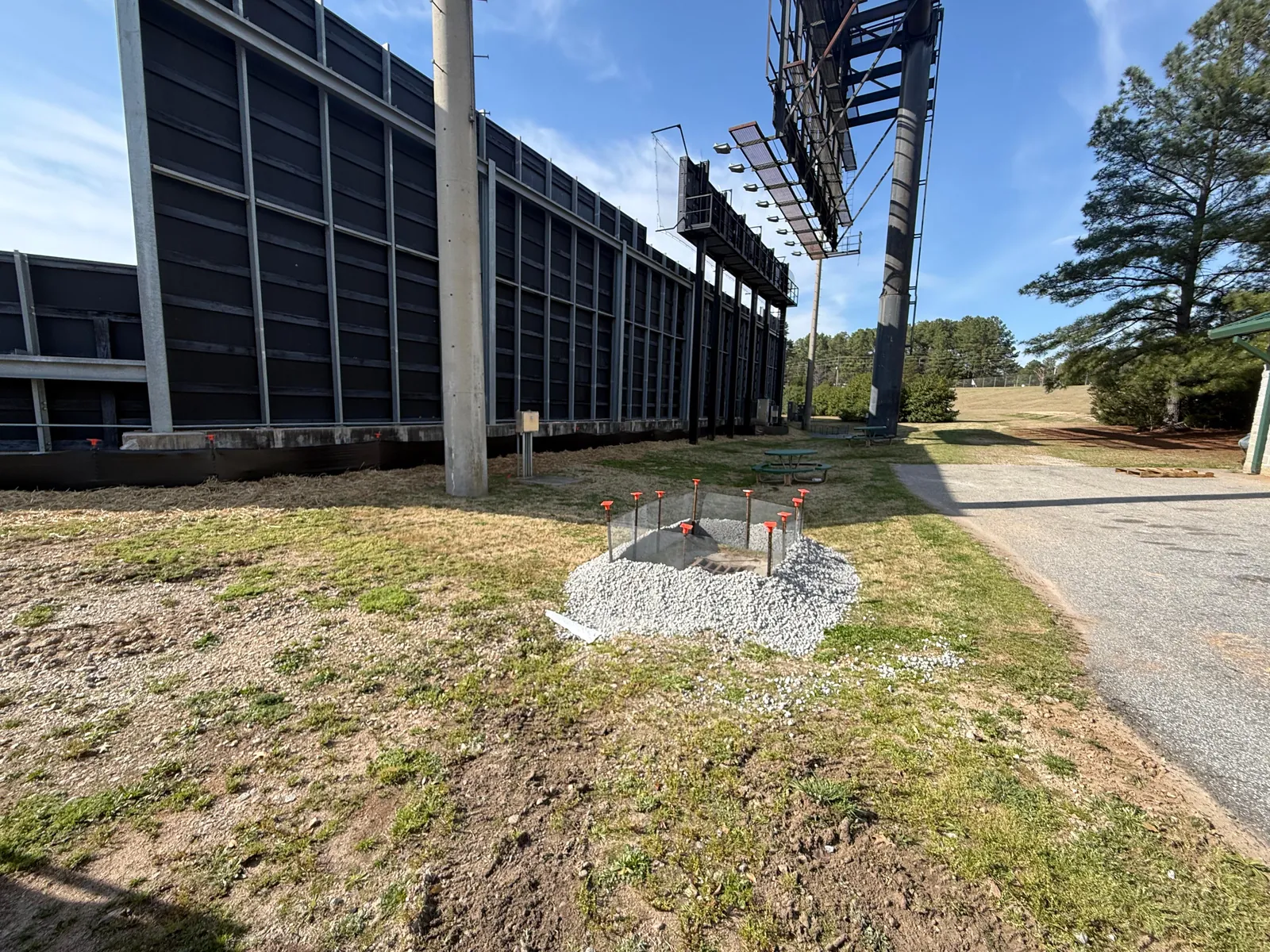Grated drop inlet with stone protection on a commercial site